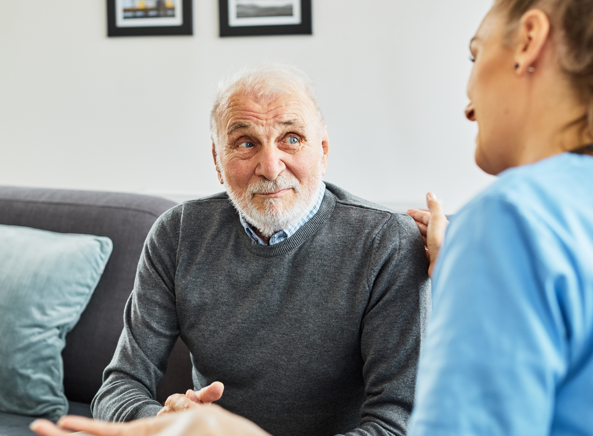 Image showing an older couple discussing bruising after hernia surgery with their doctor.